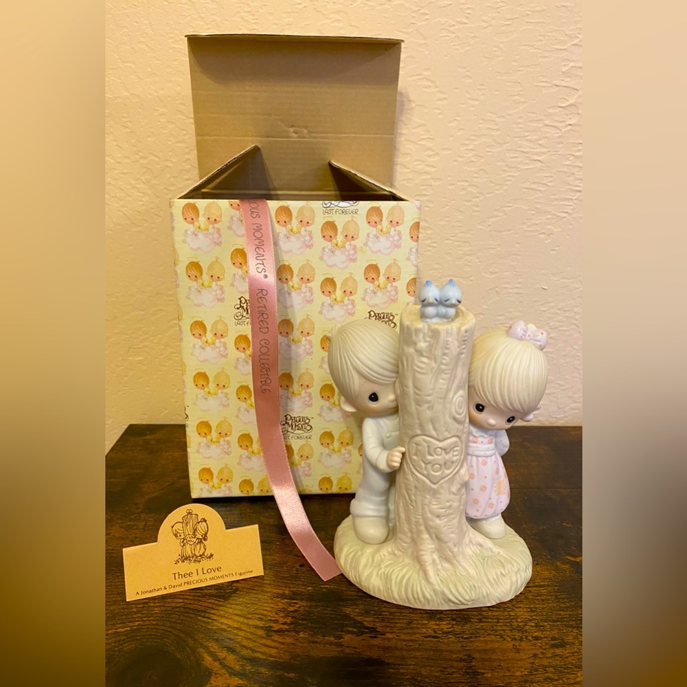 Artwork by the late Sam Butcher. Retired Precious Moments Figurine.